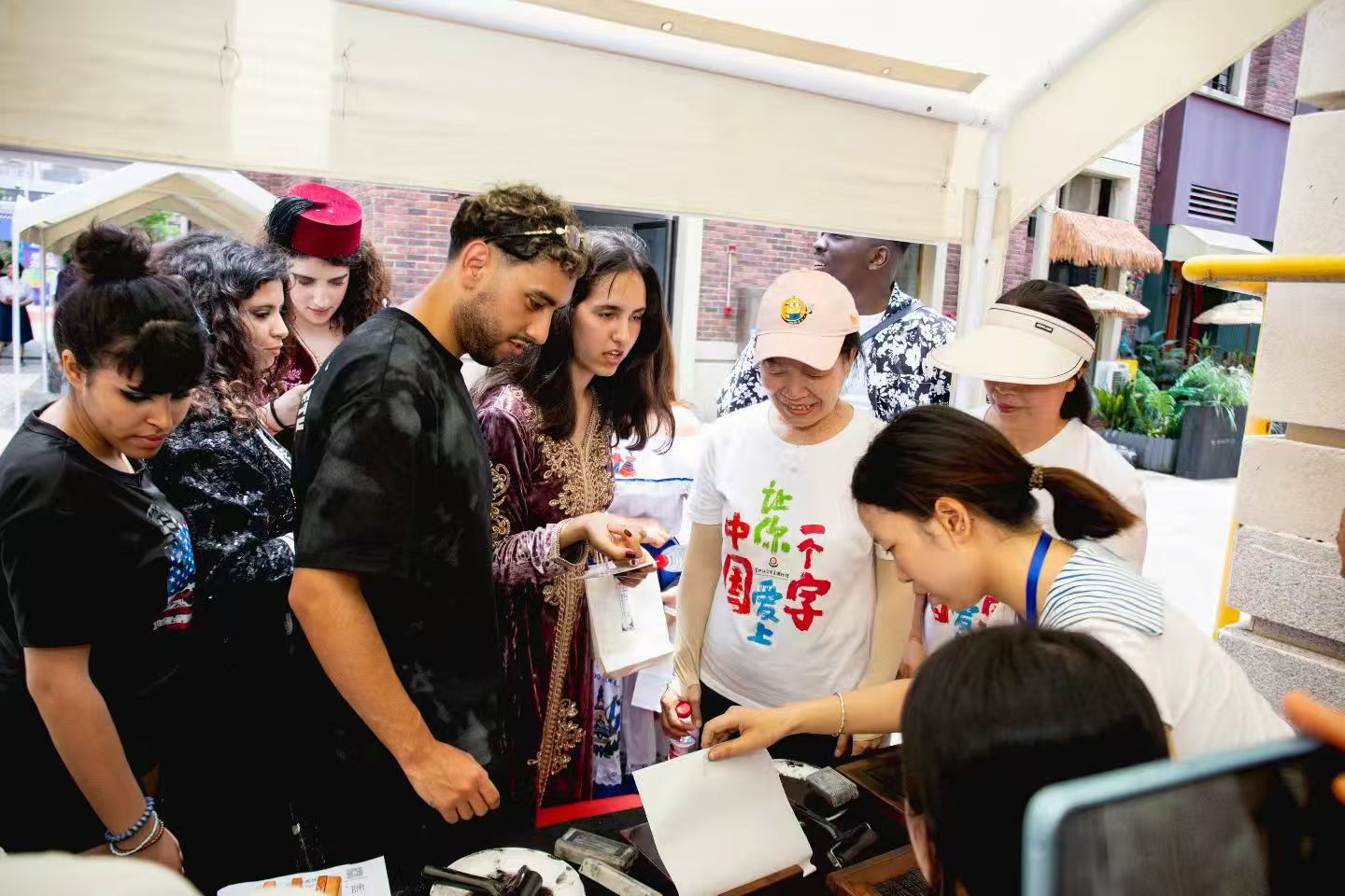 Students participating in a Chinese printing workshop